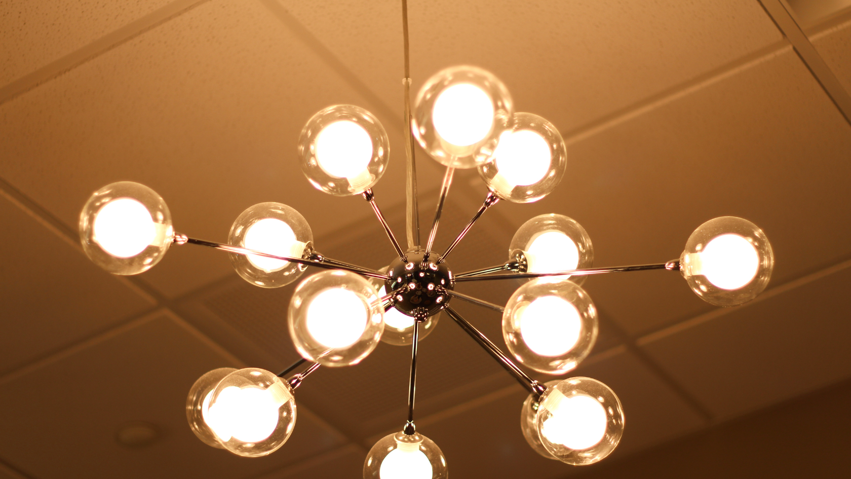 A chandelier hanging from a ceiling in a room